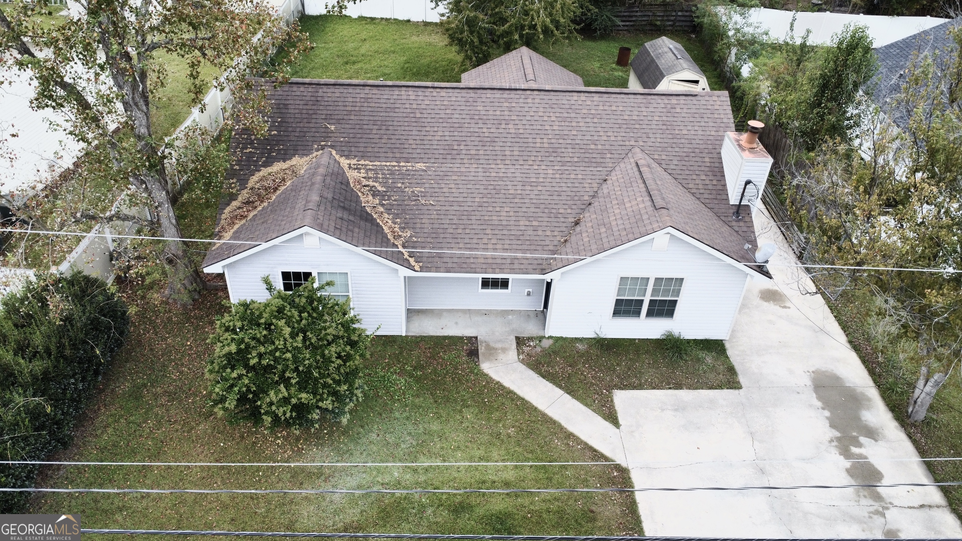 a aerial view of a house with a yard