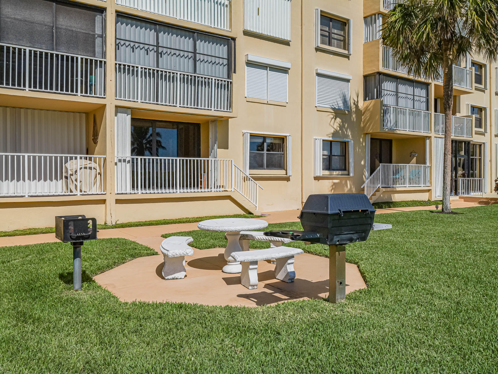 a view of a house with backyard porch and sitting area