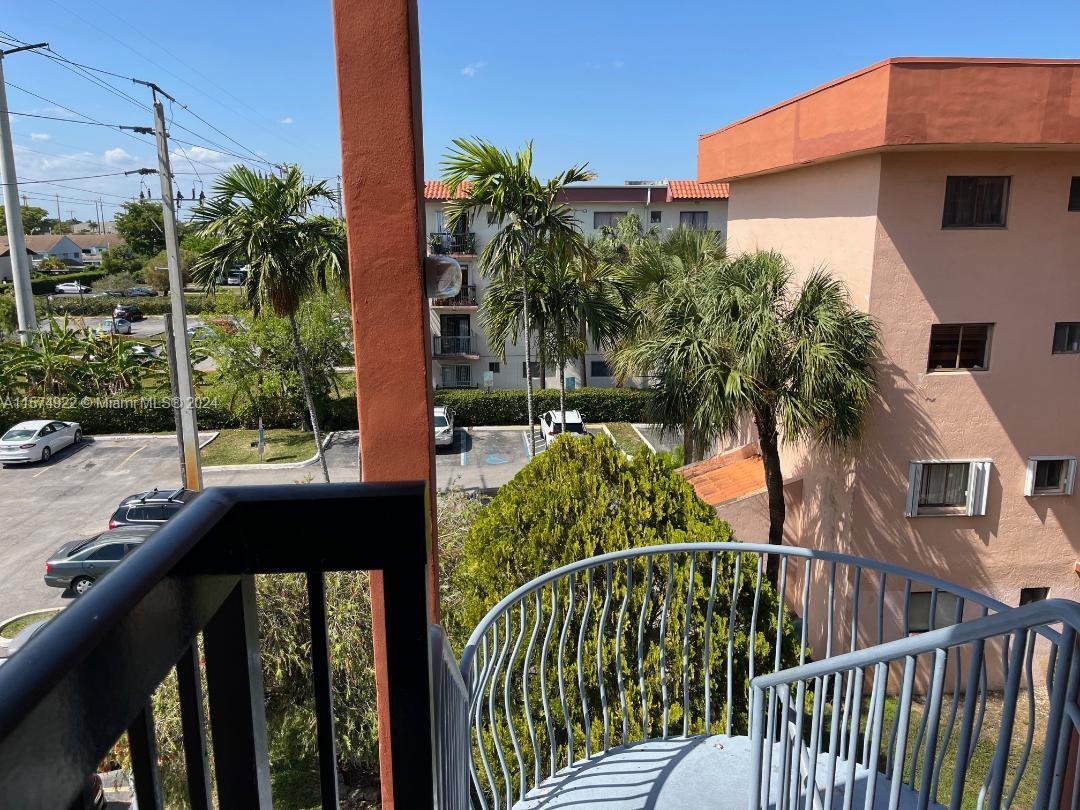 a view of a balcony with plants