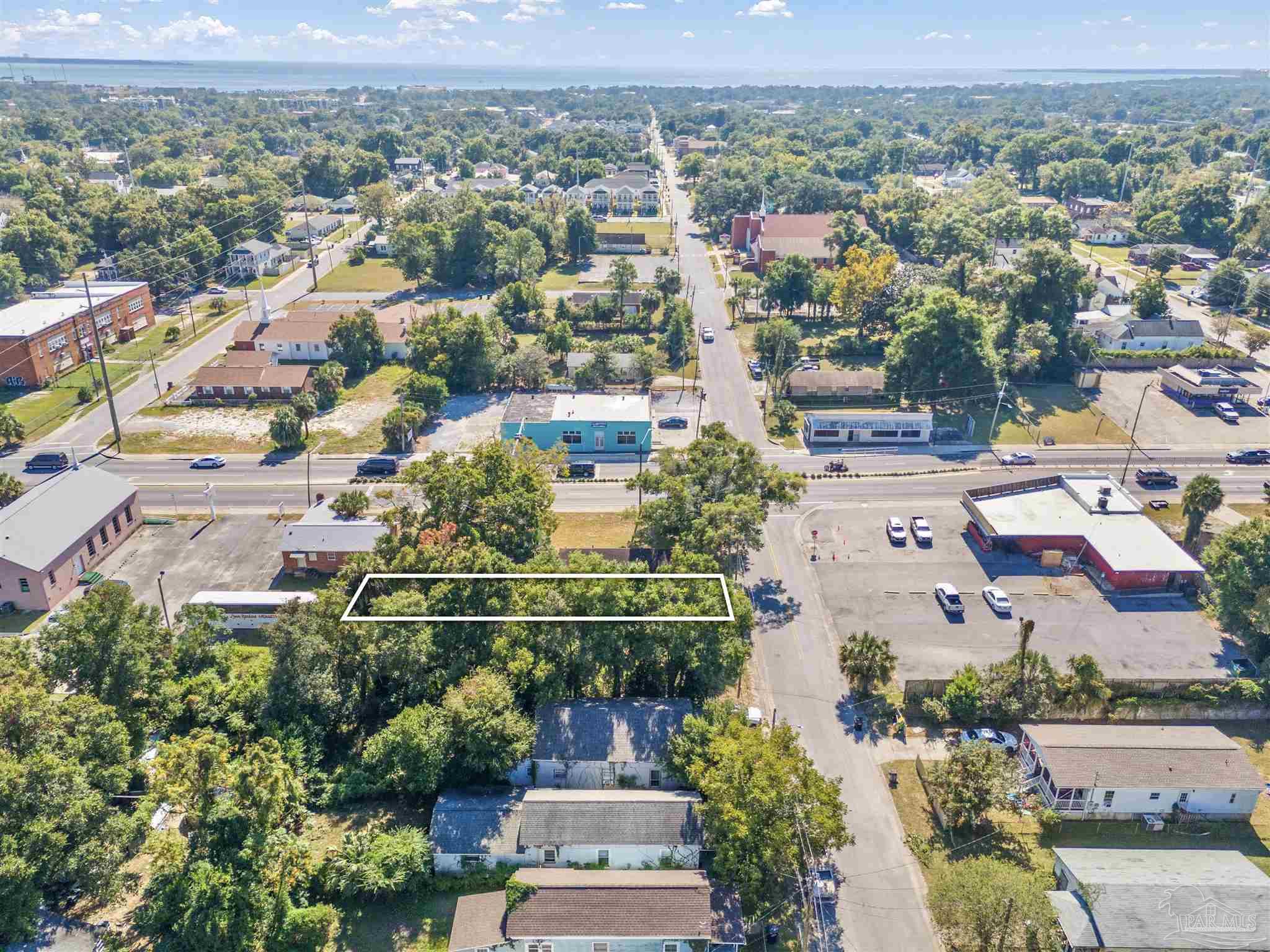 an aerial view of a houses with a city view