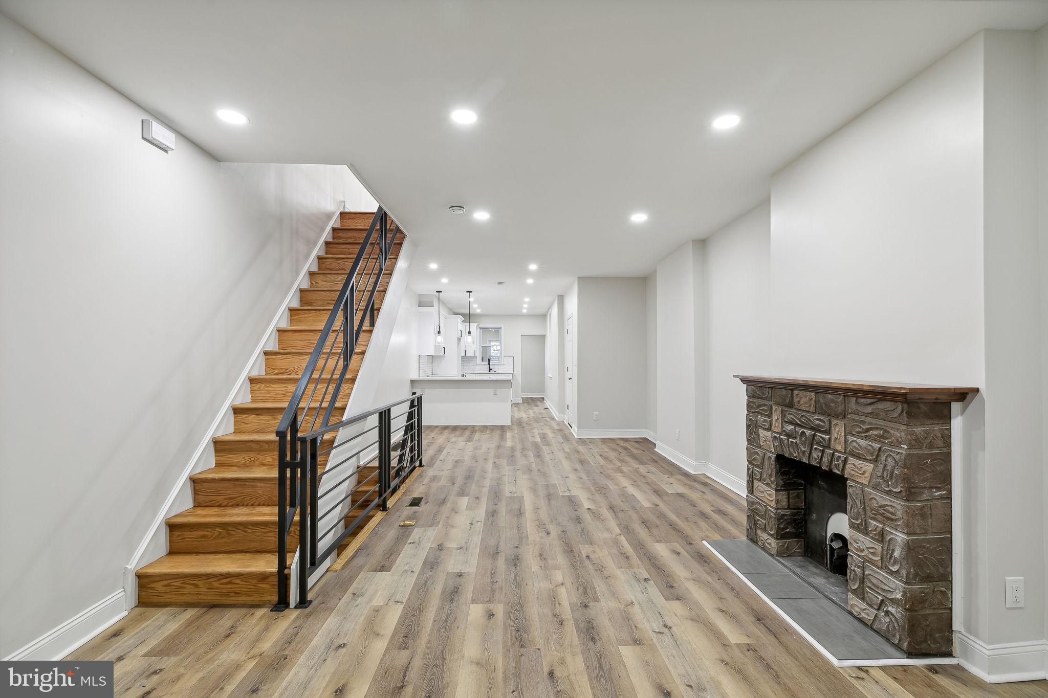 a view of entryway with wooden floor and a rug