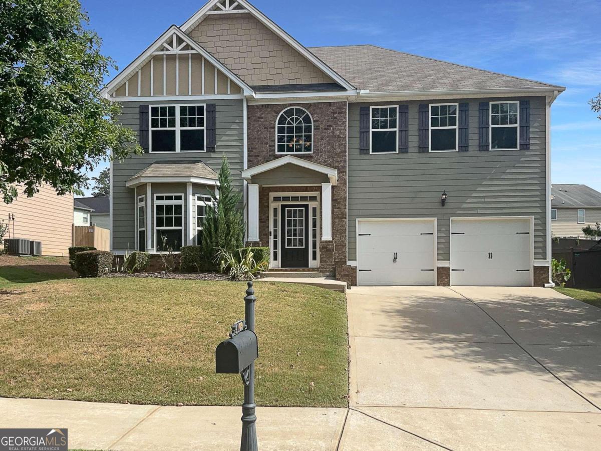 a front view of a house with yard