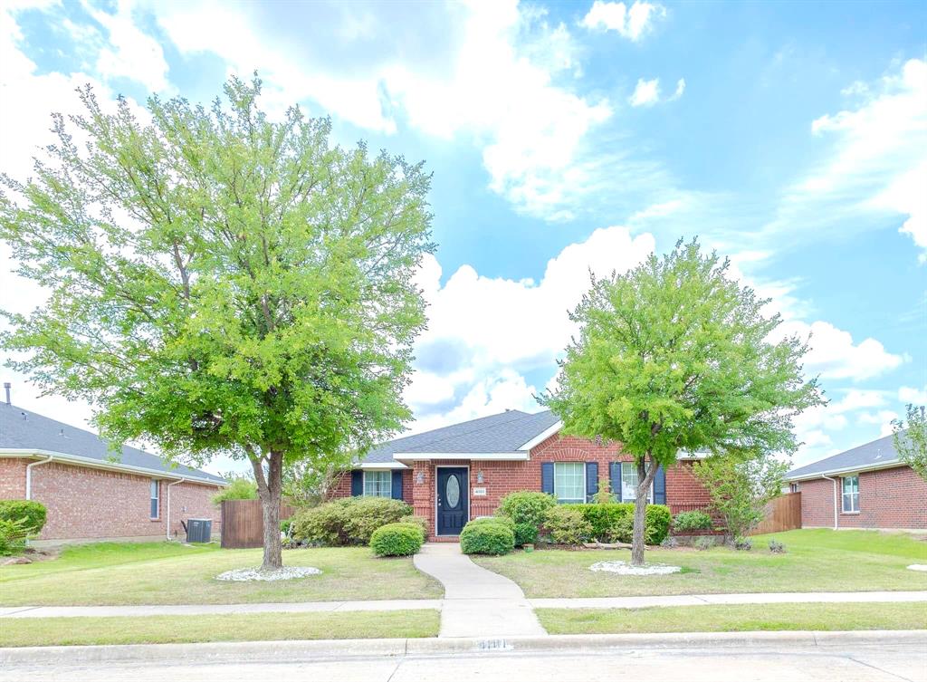 Ranch-style house featuring a front lawn