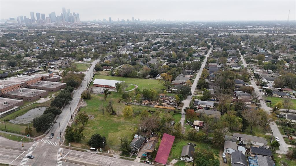 an aerial view of residential building with green space