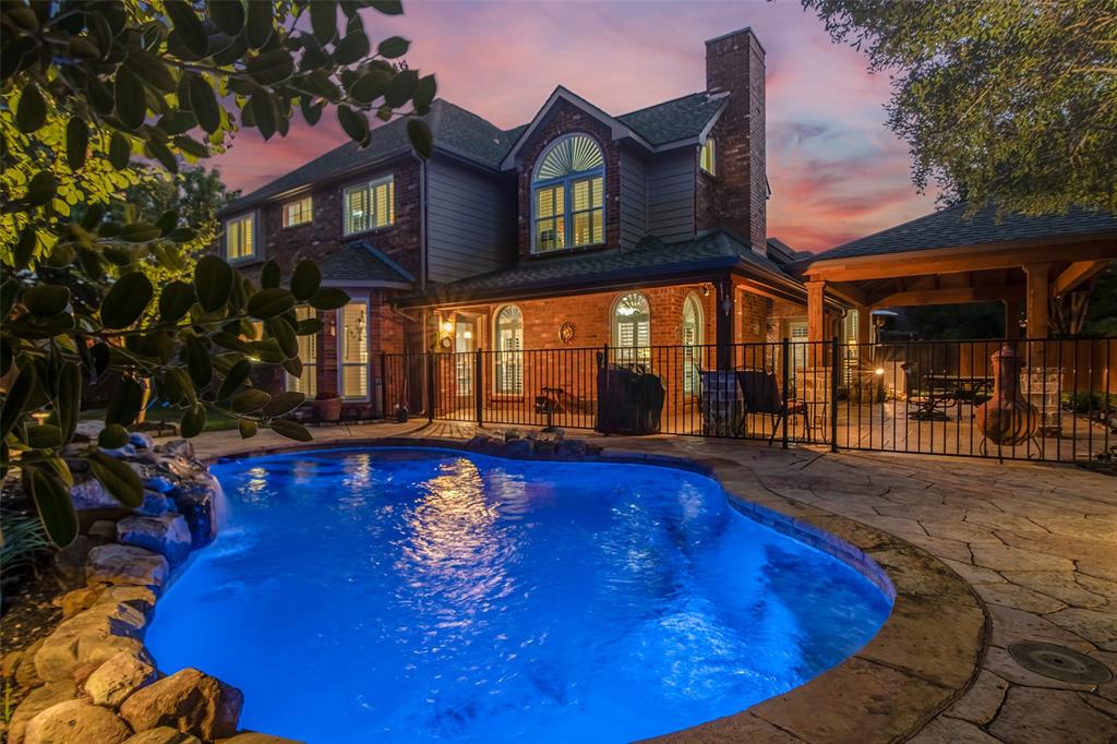 a view of a house with swimming pool yard and patio