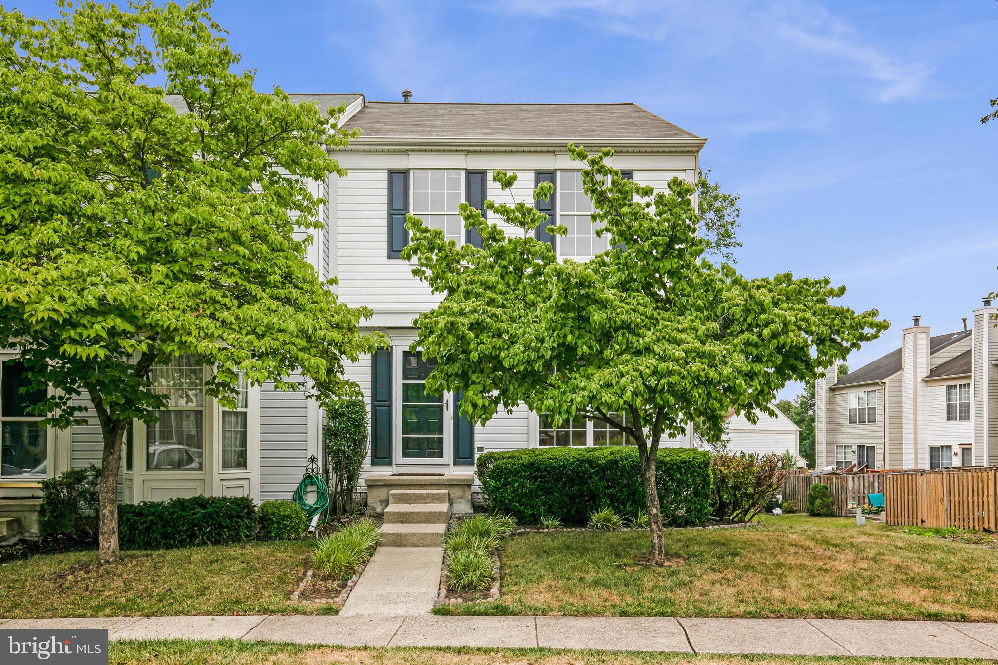 front view of a house with a tree