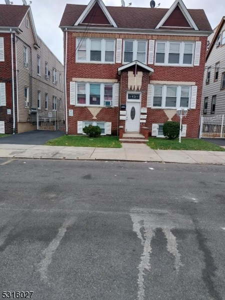 a front view of a building with street view