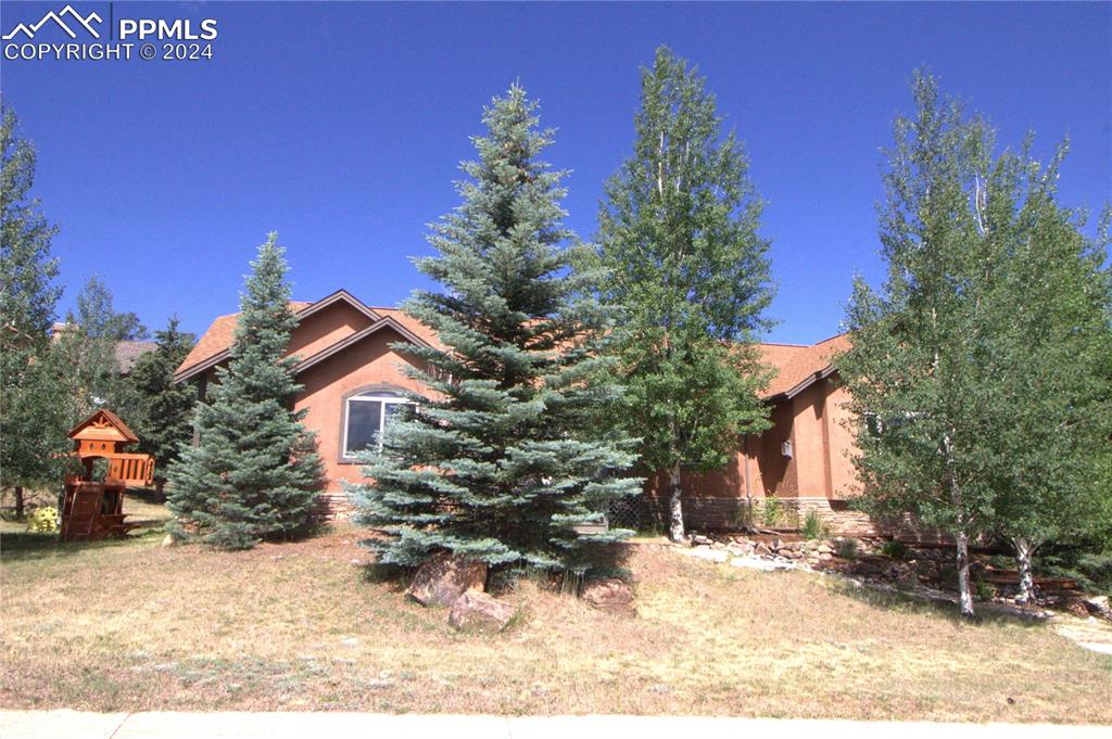 a front view of a house with a yard