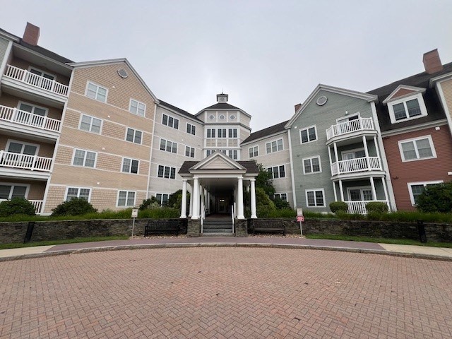 a front view of a building with garden