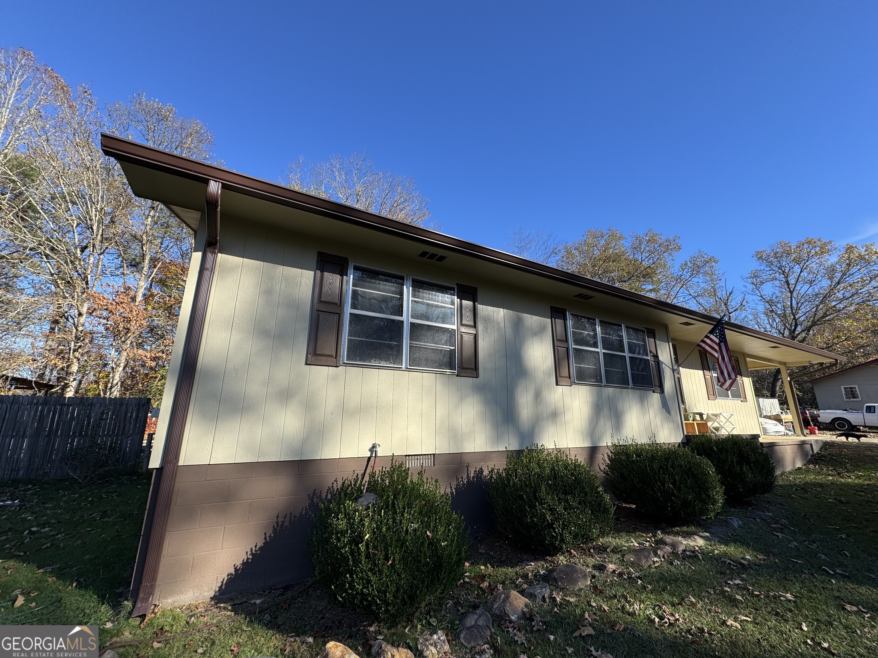 a view of house with backyard