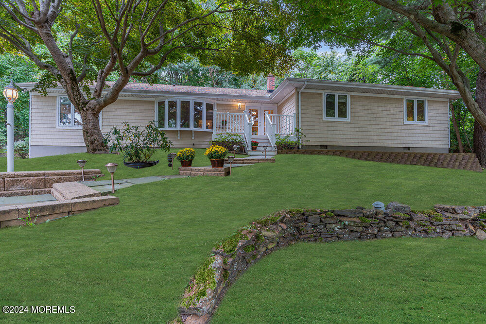 a view of a house with a yard porch and sitting area