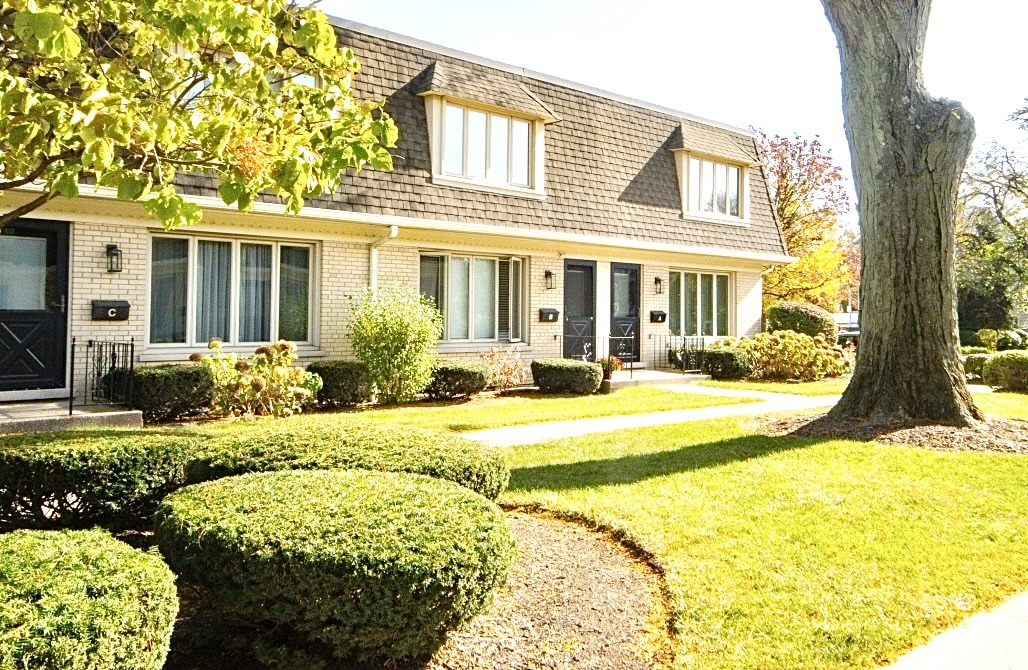 front view of a house with a swimming pool