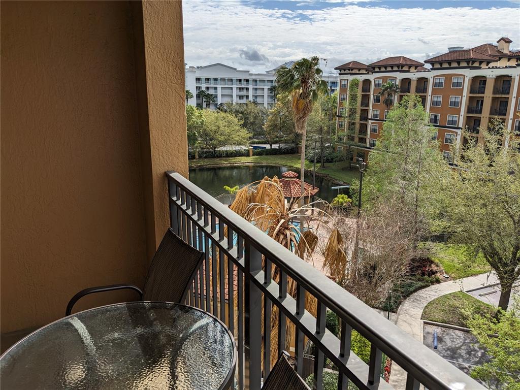 a view of balcony with furniture