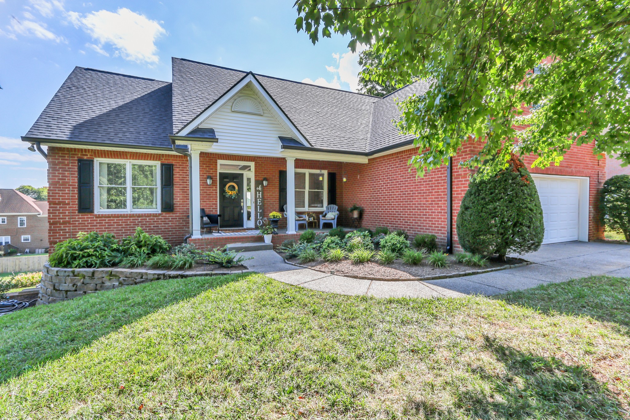 front view of a house with a yard