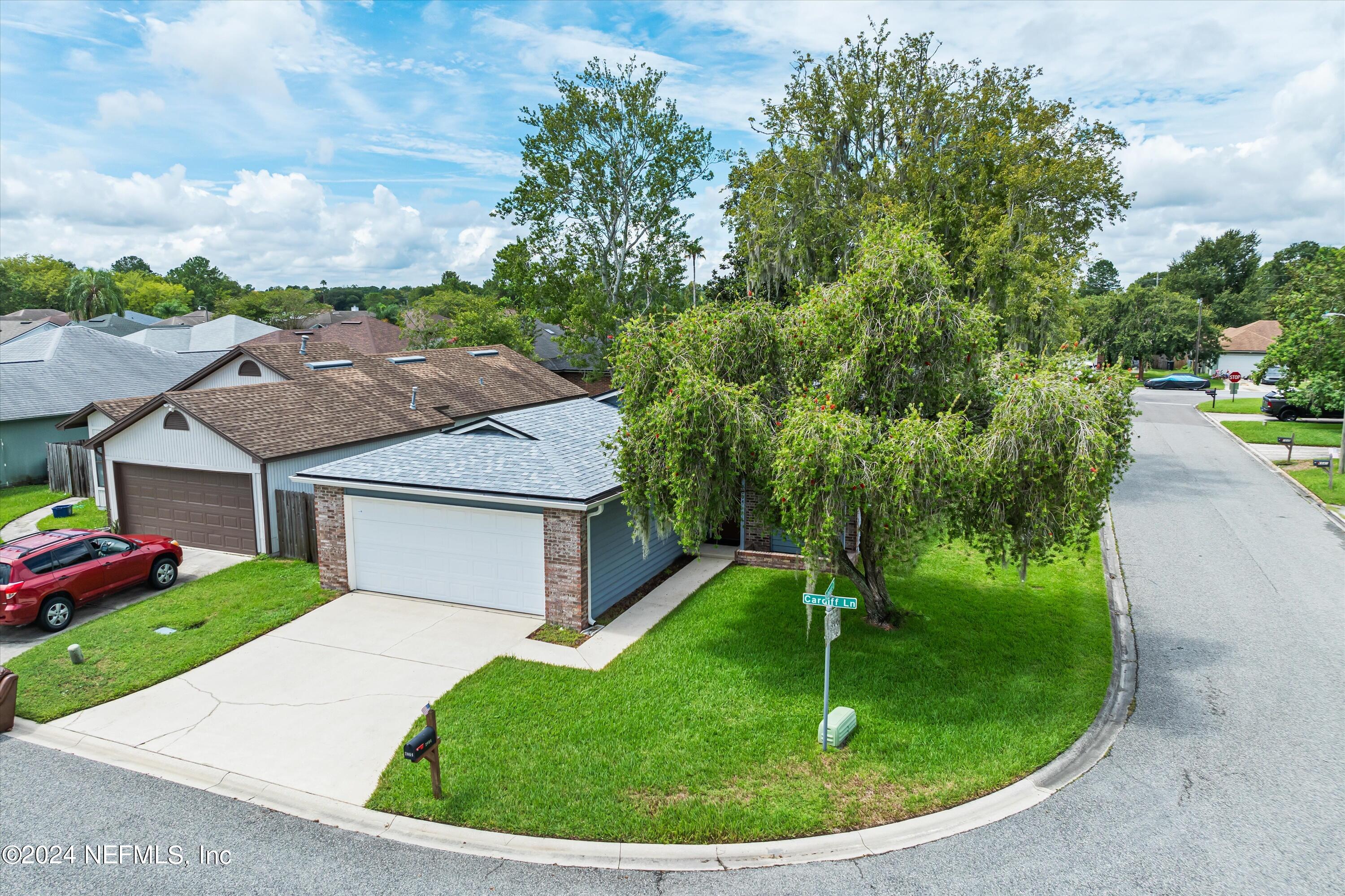 a house view with a garden space