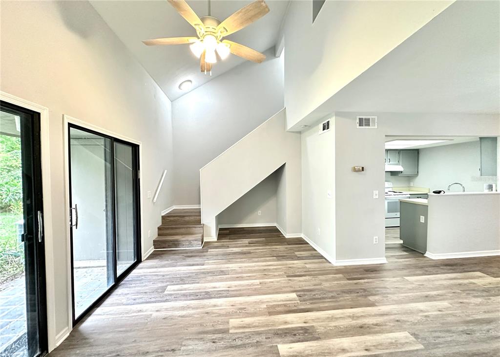 a view of a living room and entryway