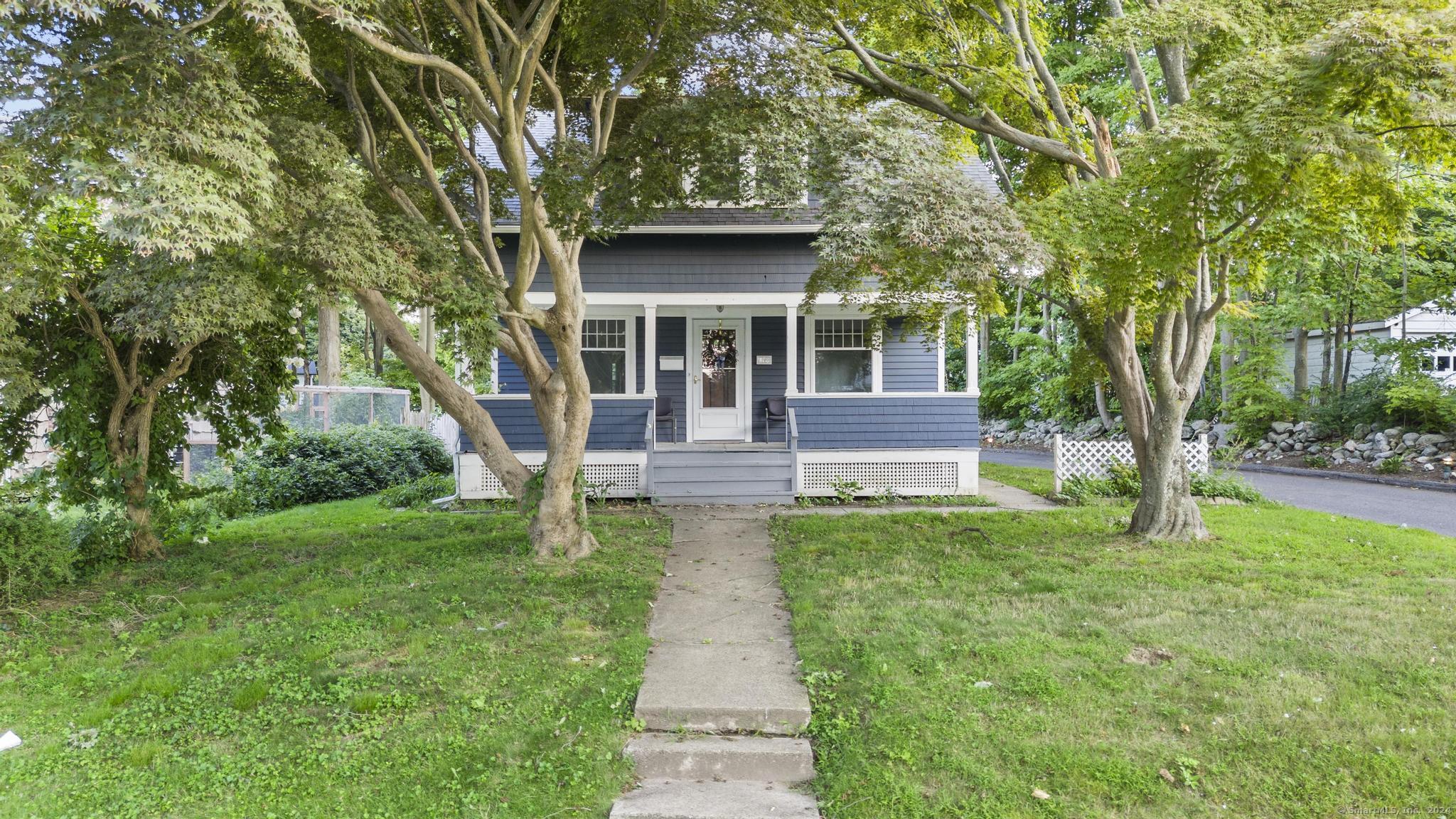 front view of a house with a yard