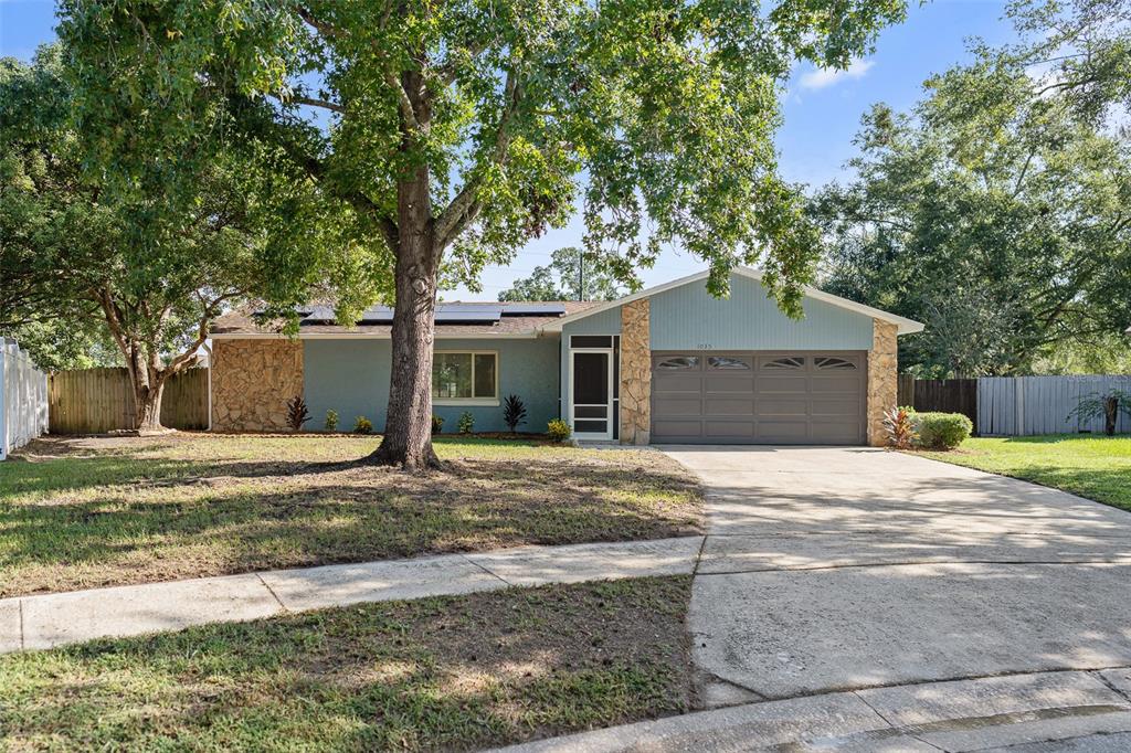 a house with trees in the background