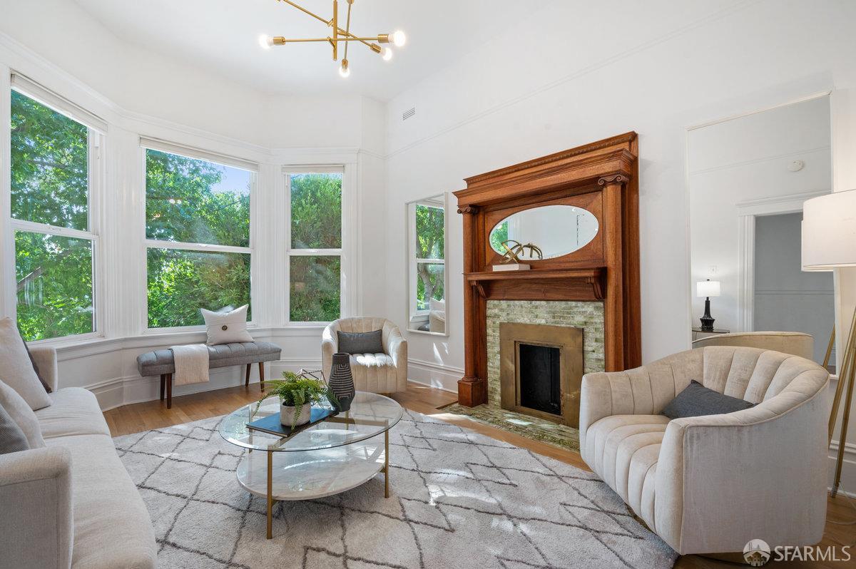 a living room with furniture and a fireplace