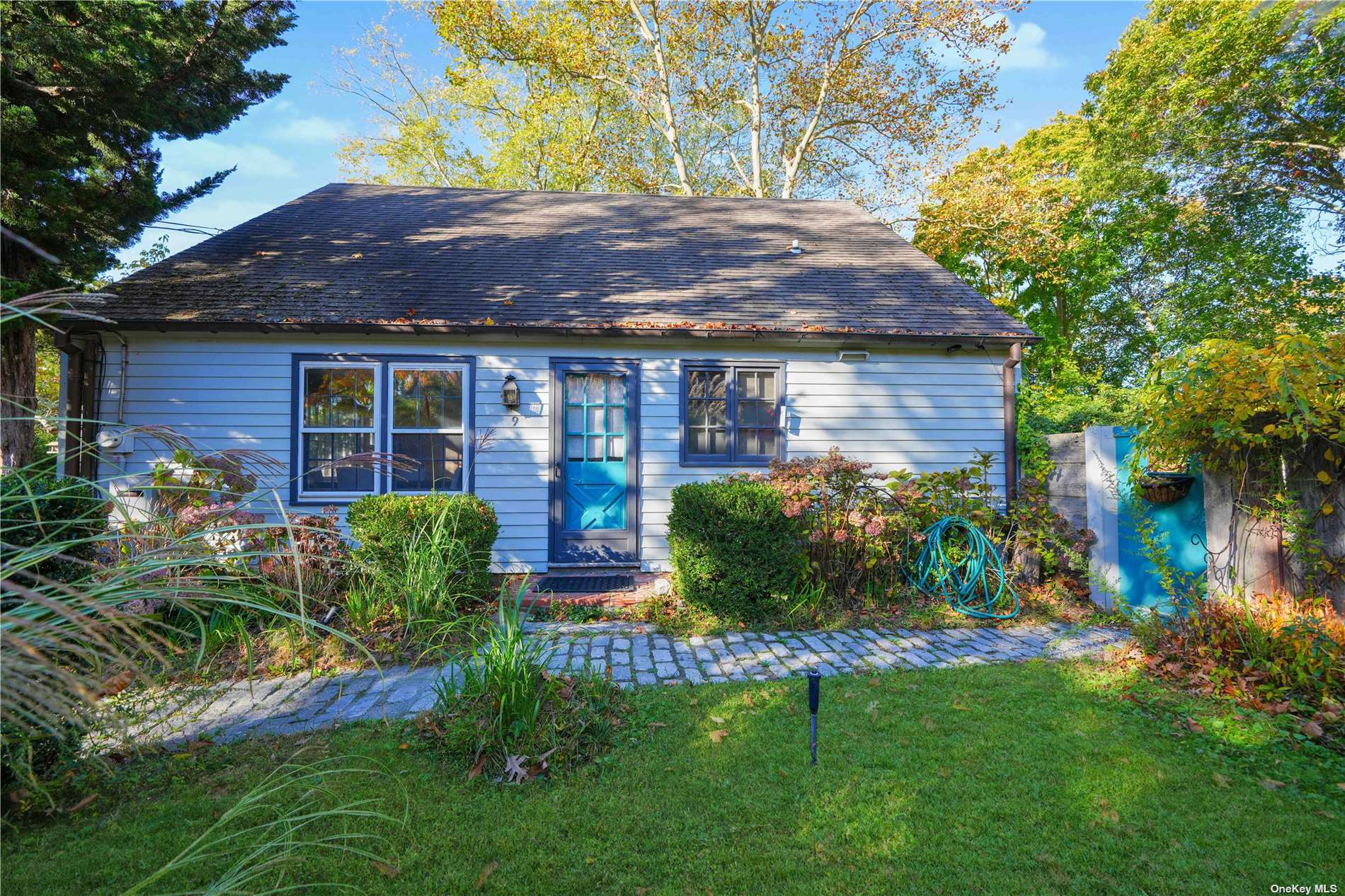 a view of a house with a yard and plants