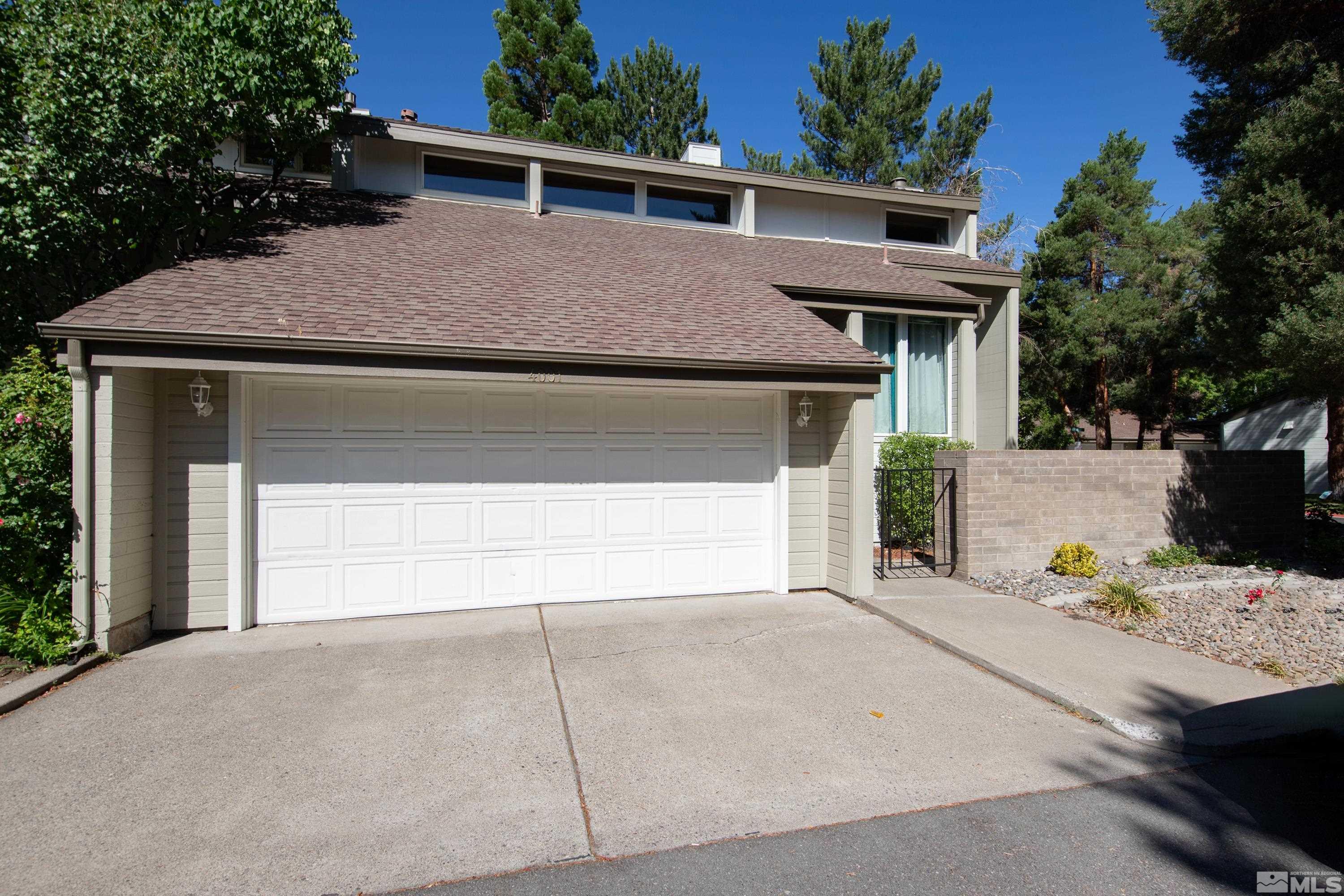 a view of house and outdoor space with garage