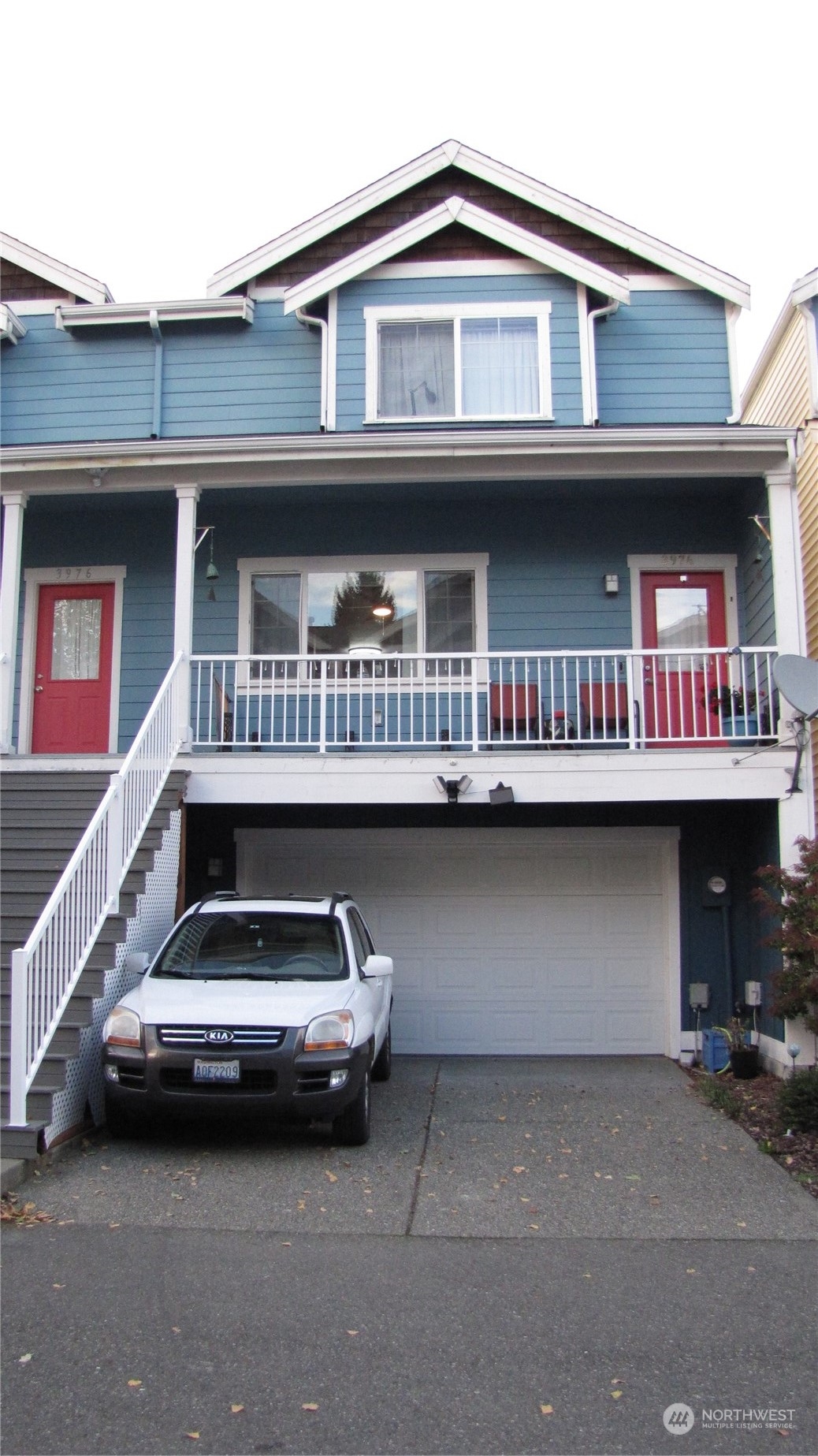 a front view of a house with parking space