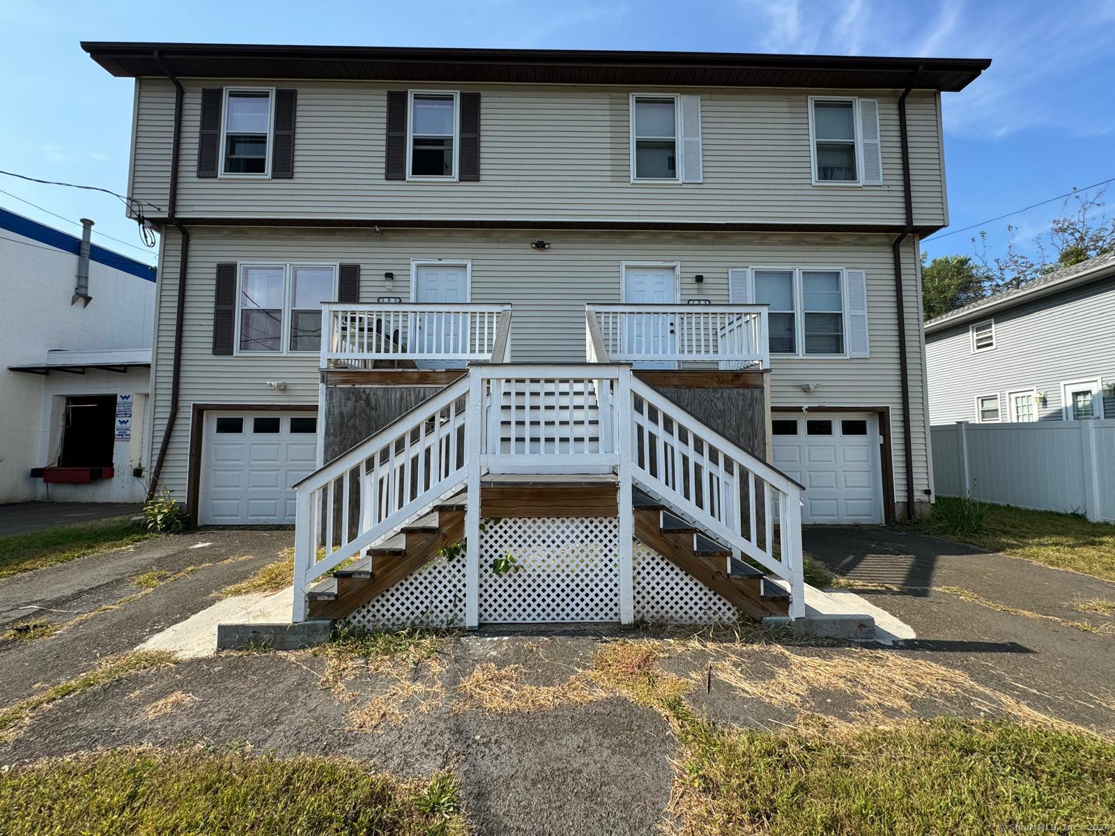 a view of a house with wooden deck