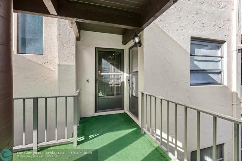 a view of a porch with a backyard