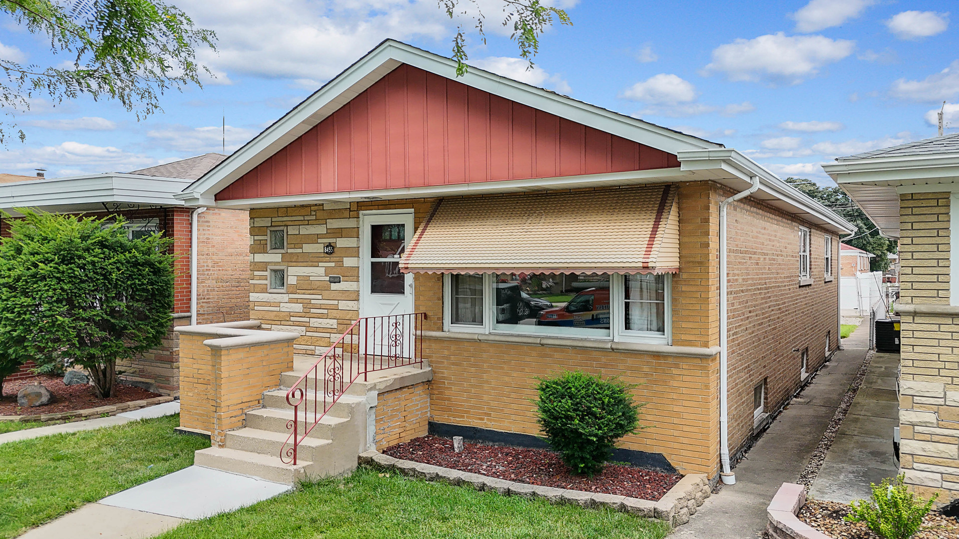 a front view of a house with a yard