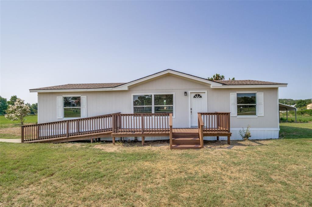 front view of a house with a yard