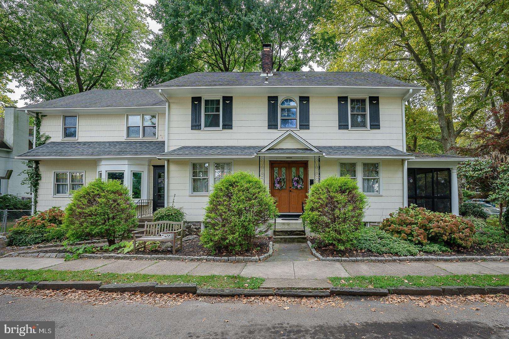 front view of a house next to a yard