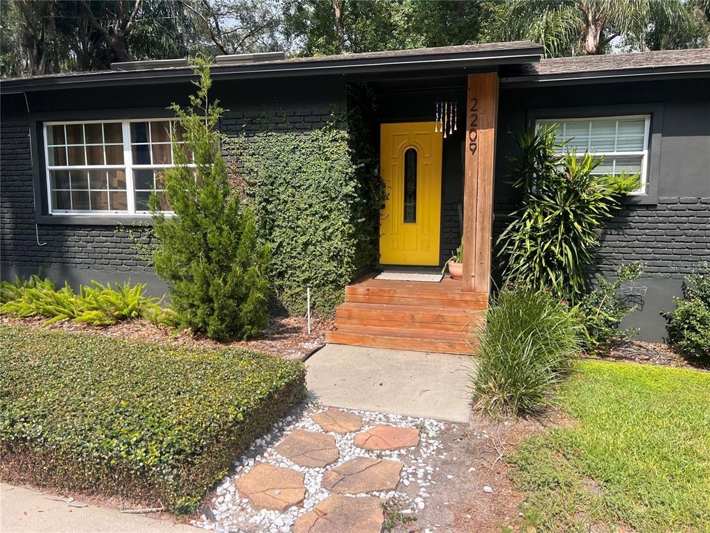 a front view of a house with garden