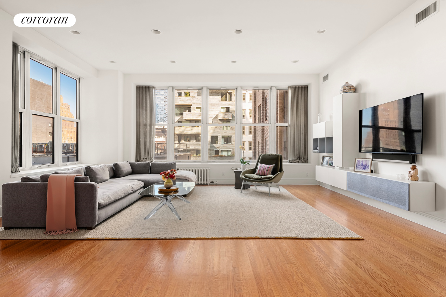 a living room with furniture and a flat screen tv