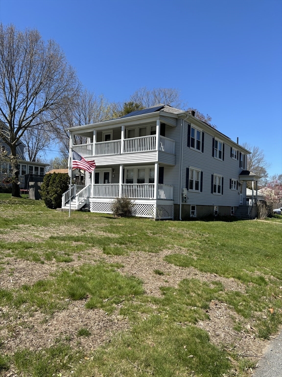 a view of a house with a yard