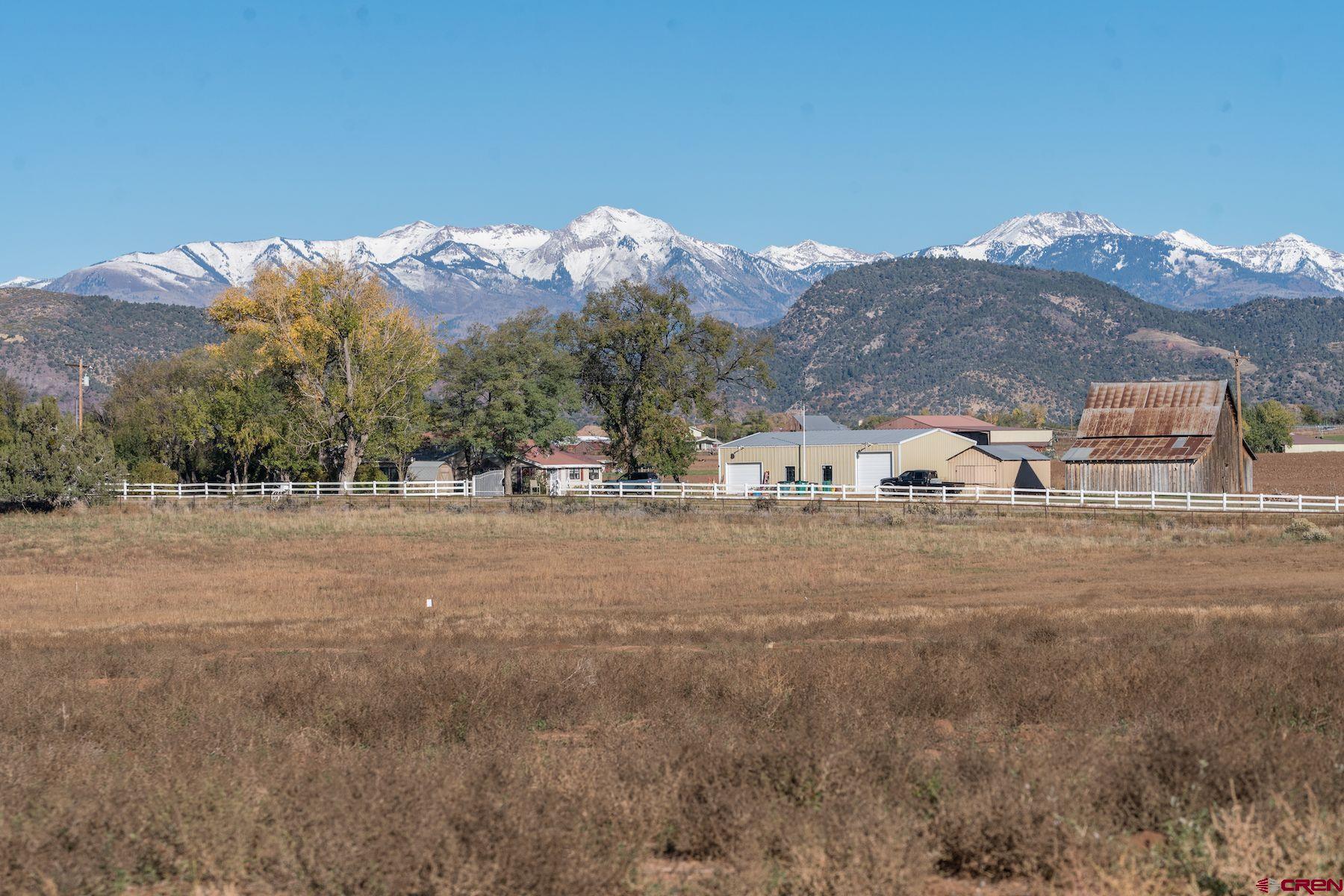 a view of a town with mountains in the background