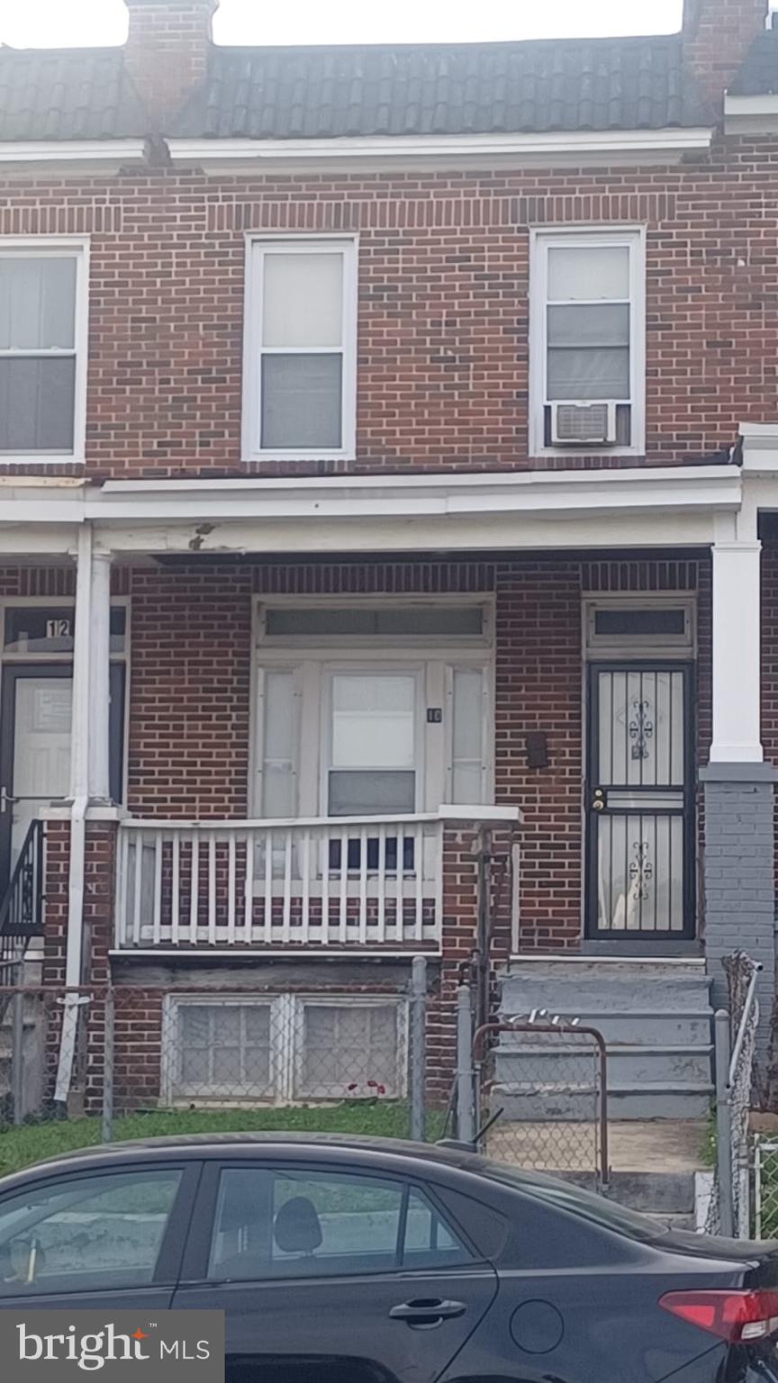 a view of front door of house with stairs