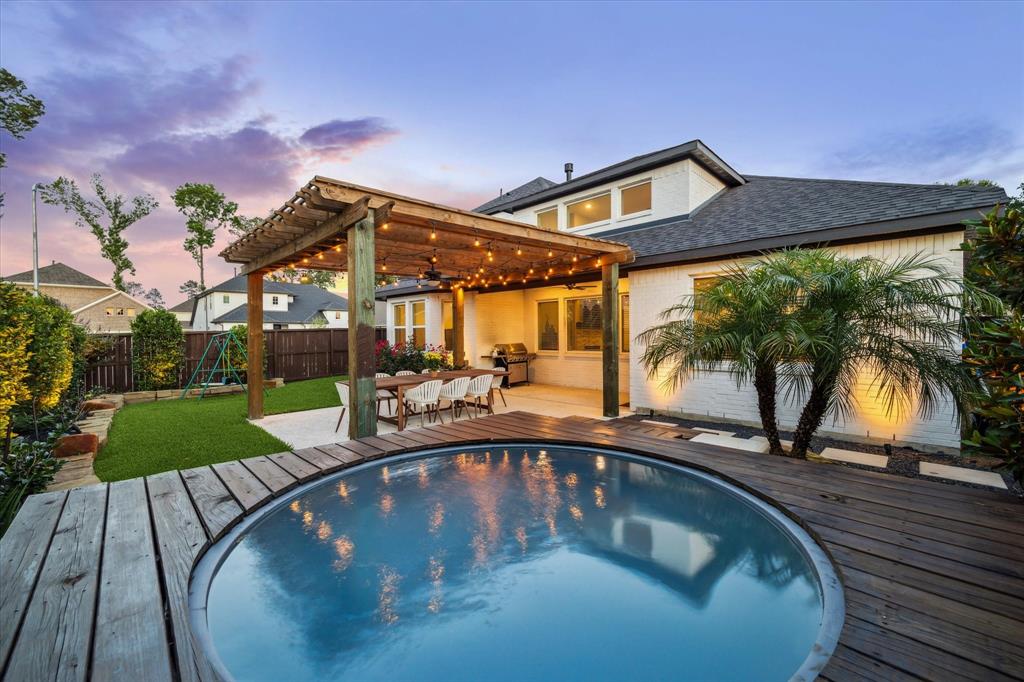 a view of a swimming pool with a patio