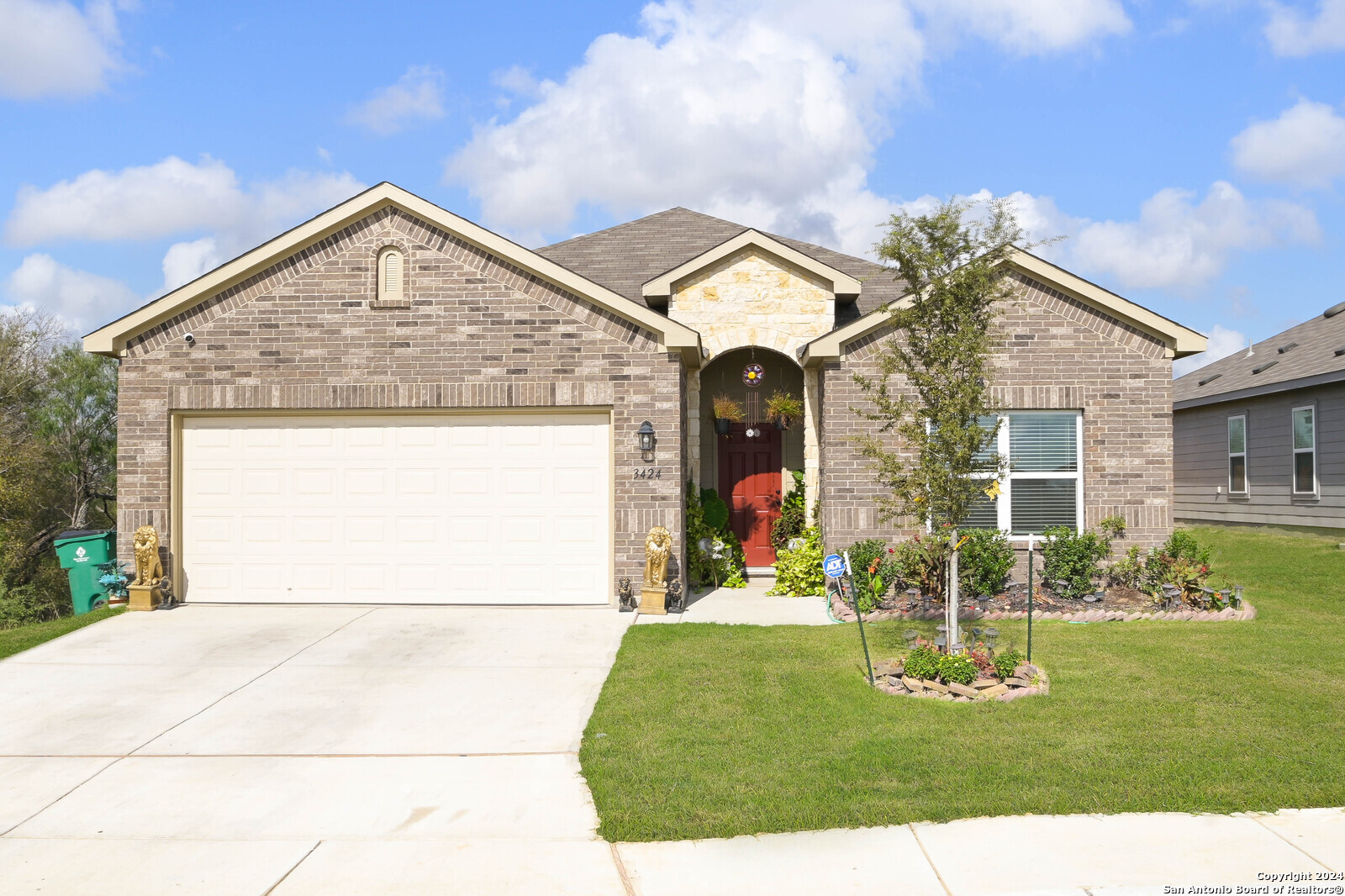 a front view of a house with garden