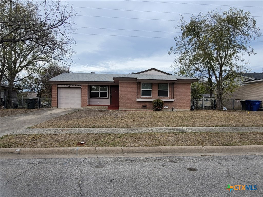 a front view of house with garage and yard