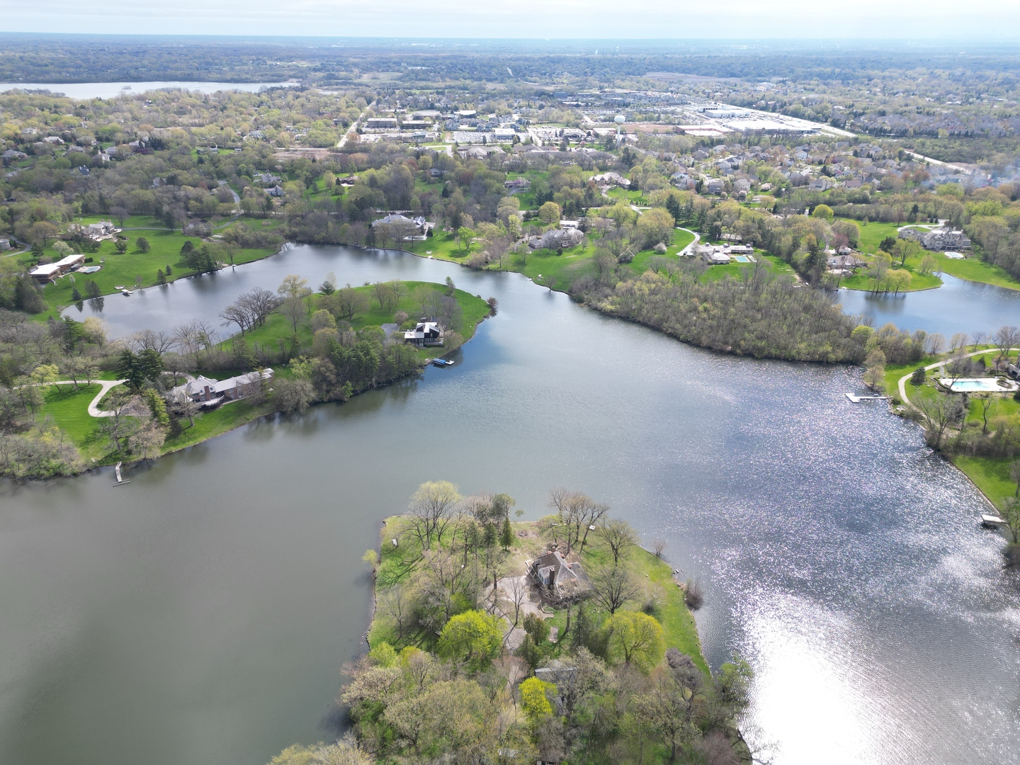 an aerial view of a house with a lake view