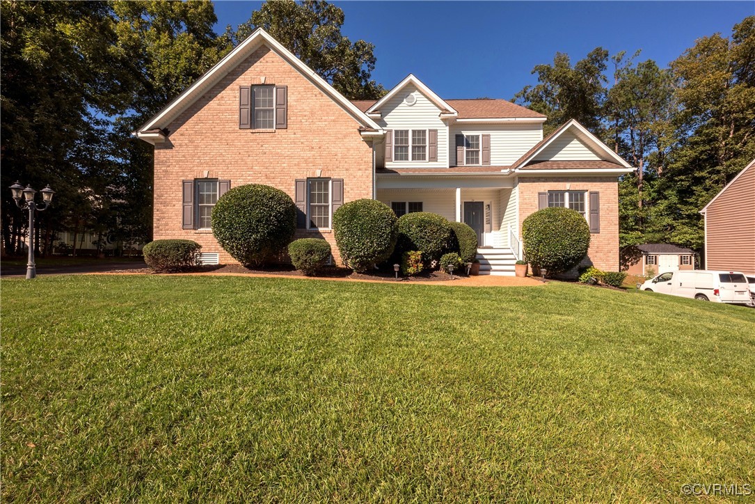 a front view of a house with a yard