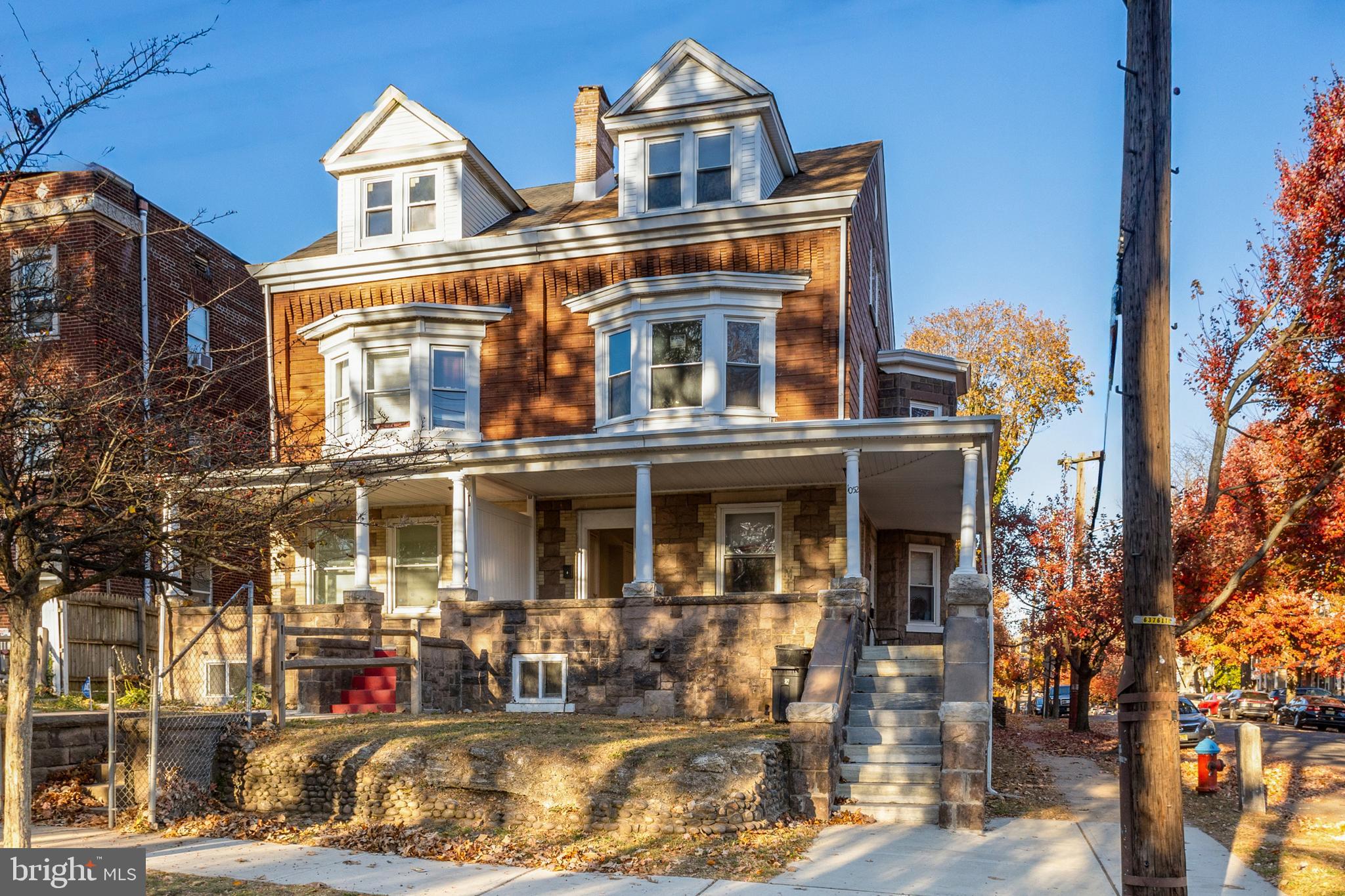 a front view of a residential apartment building with a yard