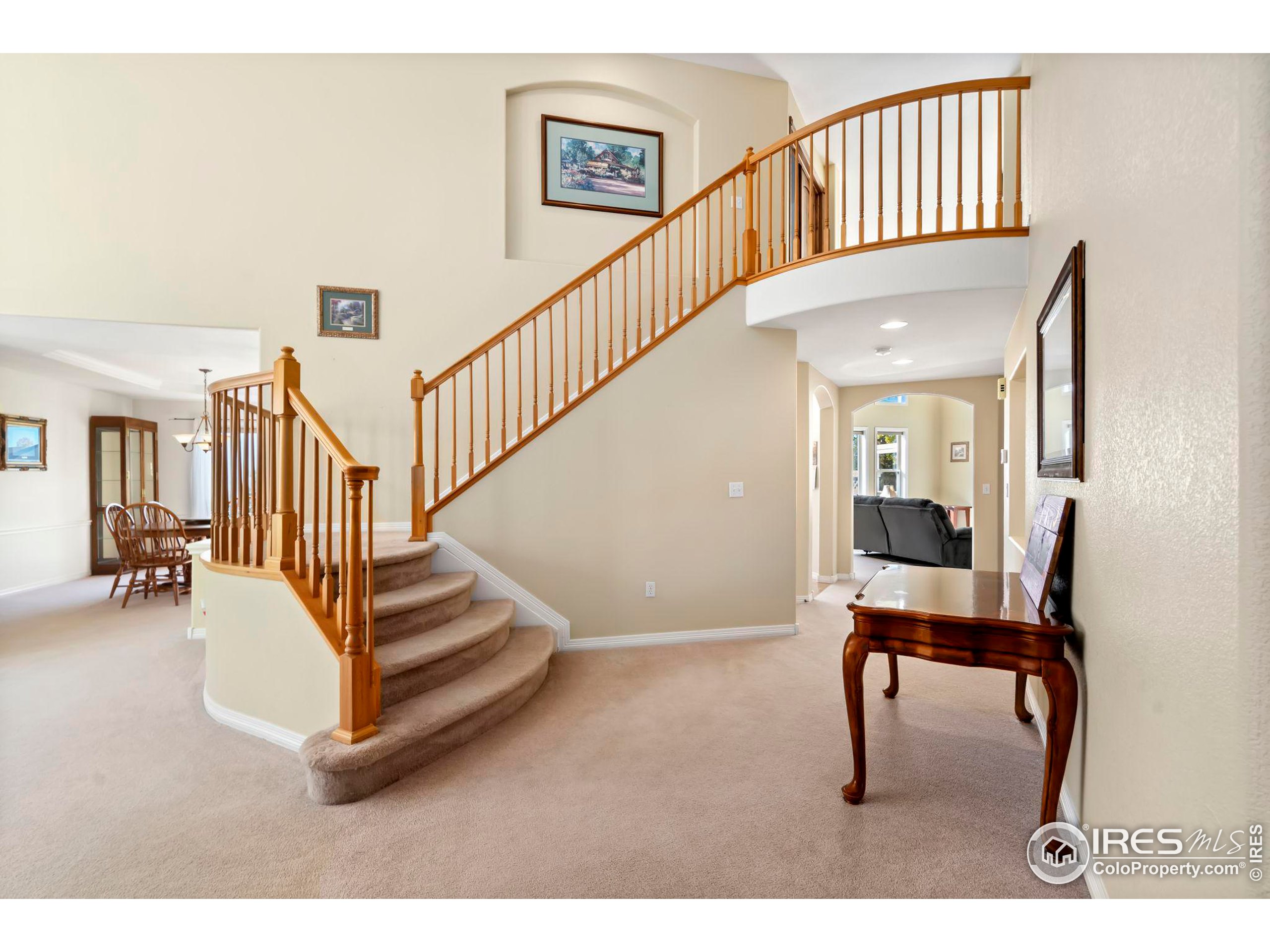 a view of entryway livingroom and hall