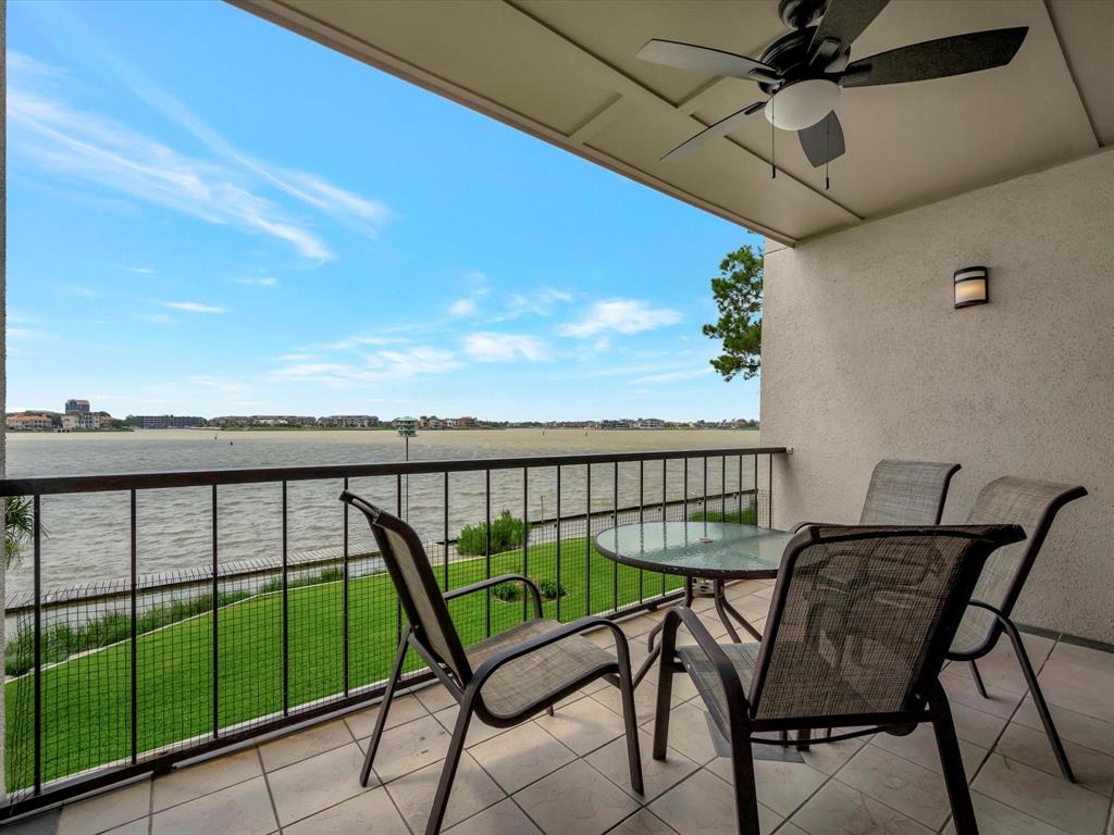 a view of a balcony with furniture