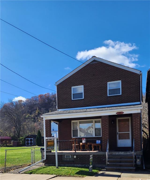 a view of house with yard