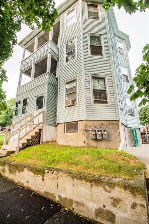 a view of house with yard