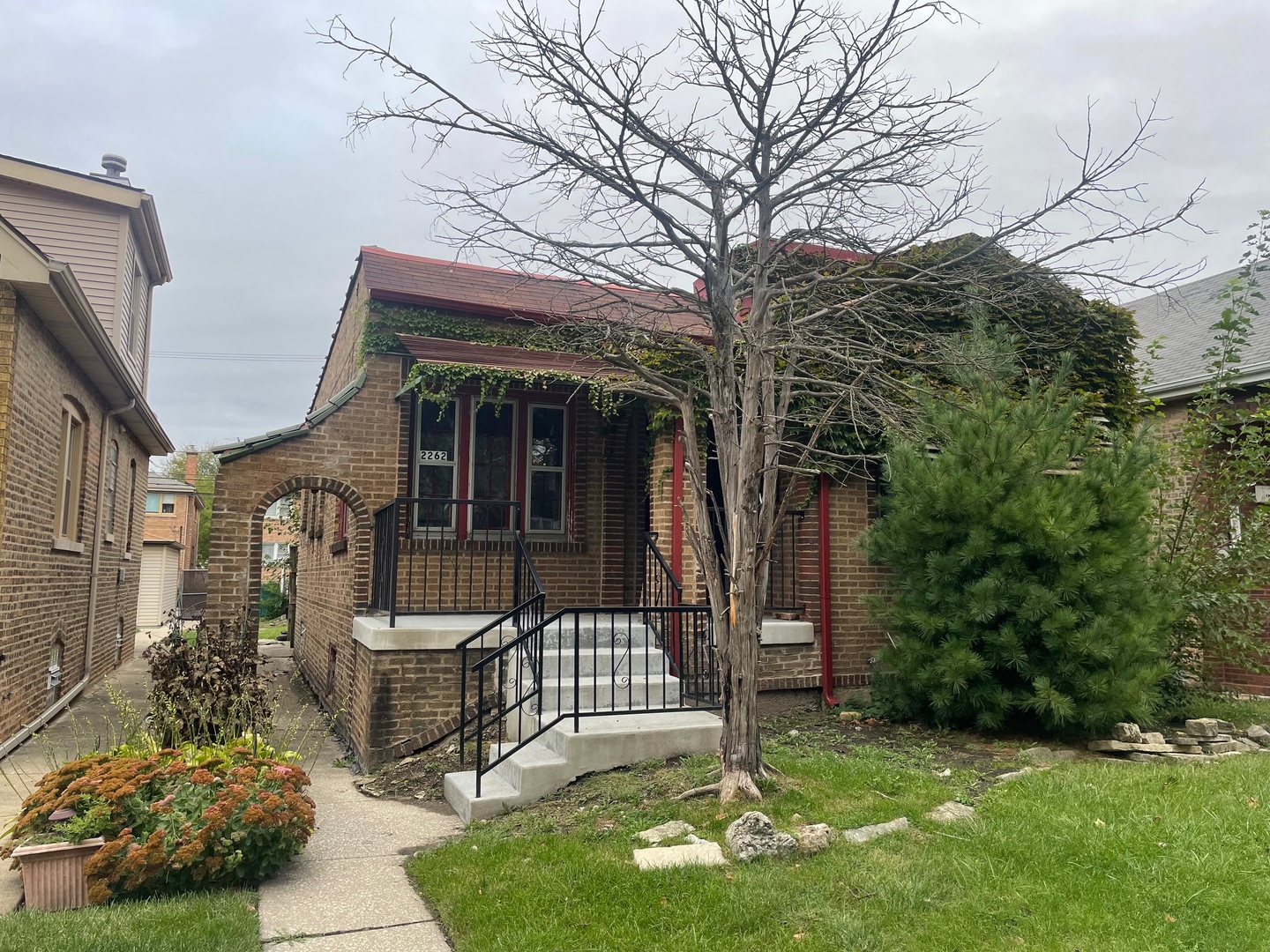 a front view of a house with garden