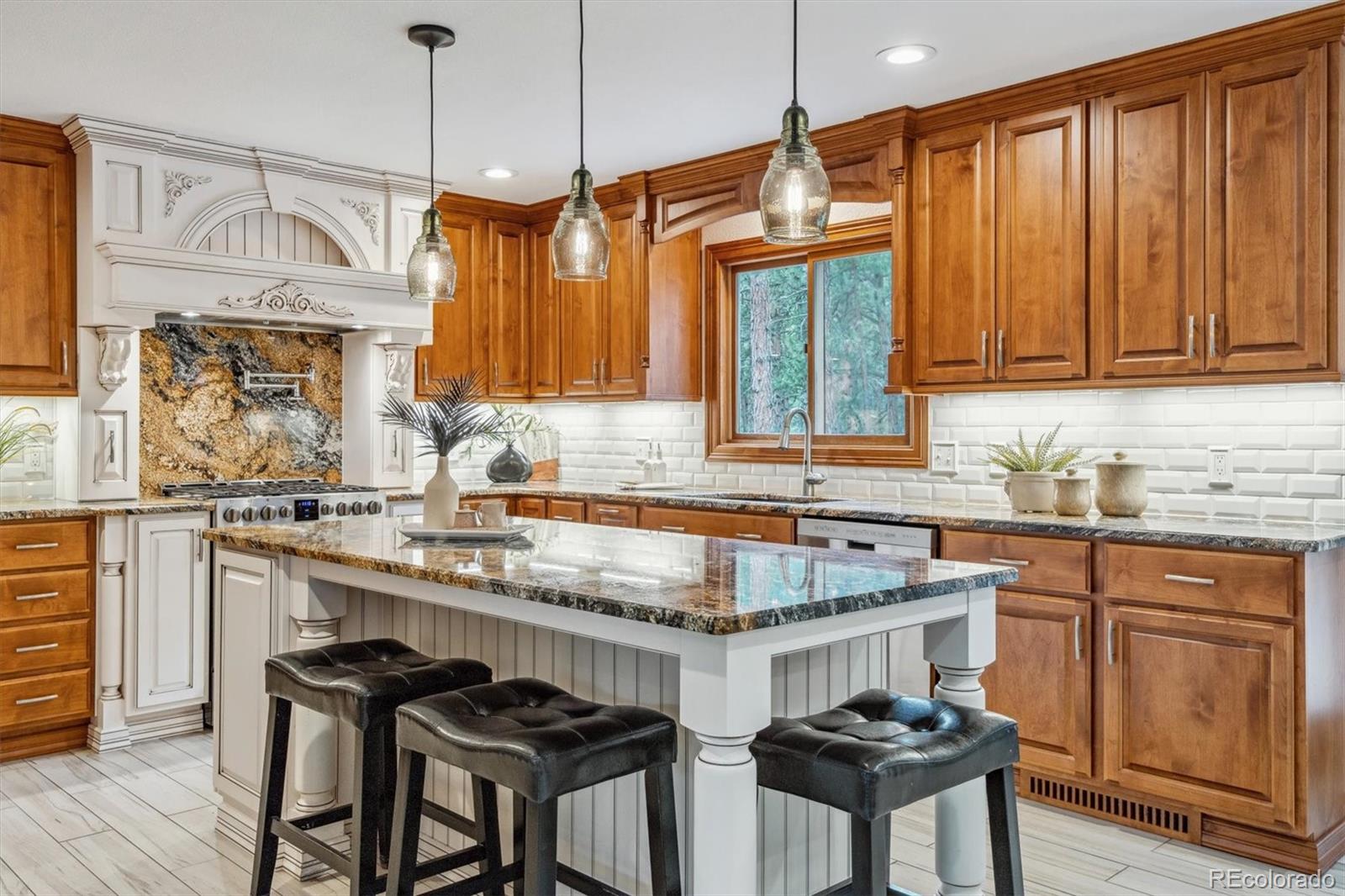 a kitchen with a sink stove and cabinets