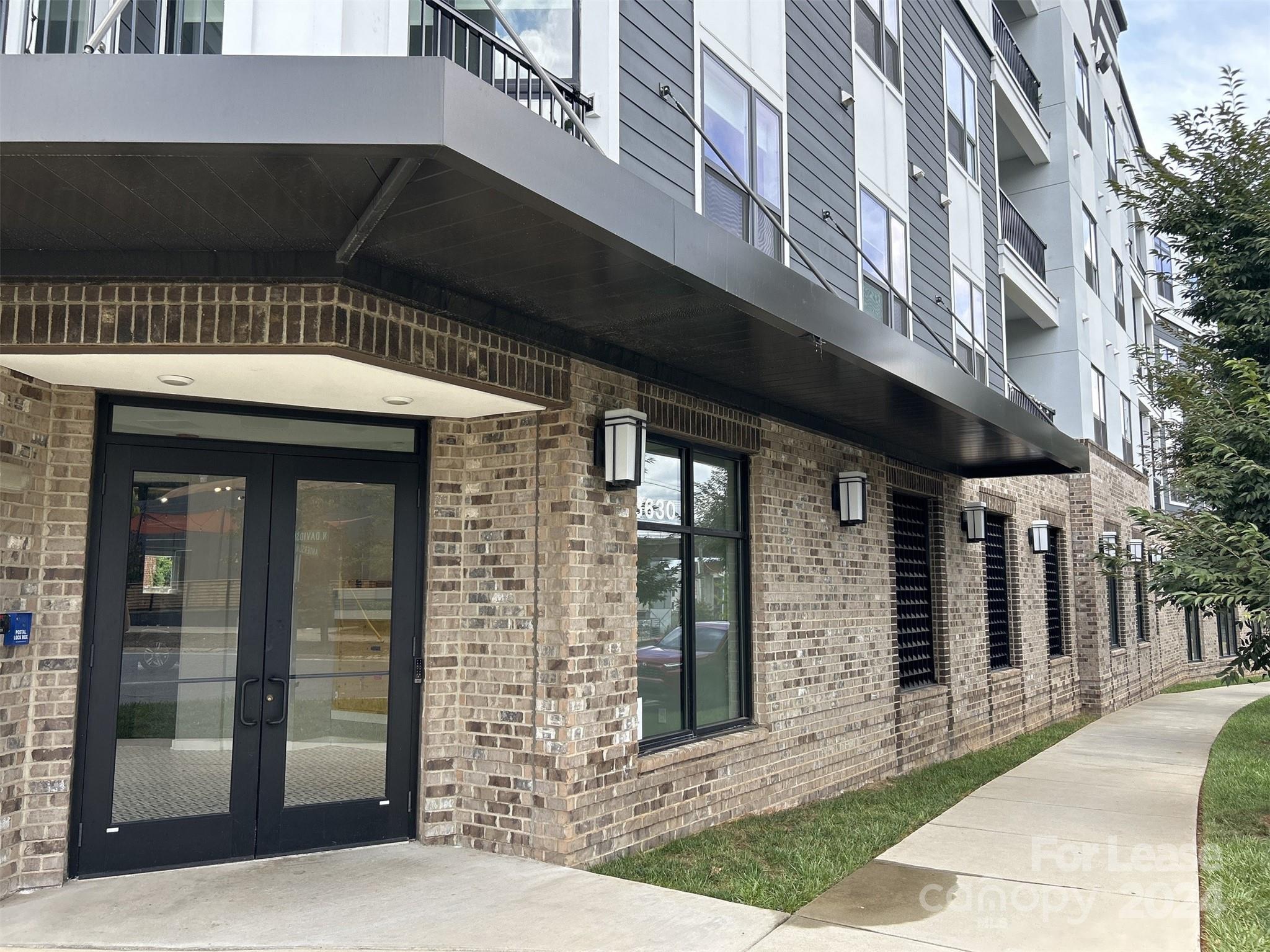 a front view of a building with a glass door