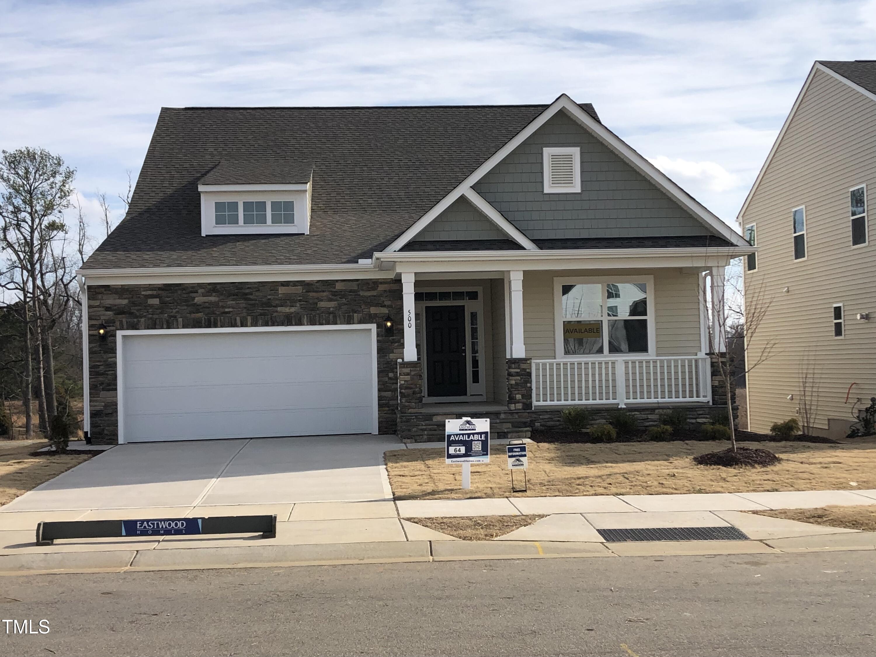 a front view of a house with a garage